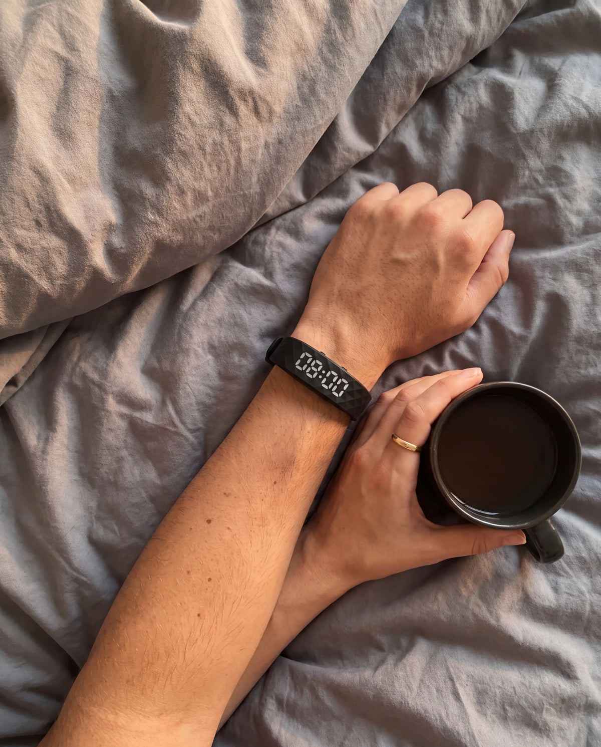 Sample photo: couple in bed, one wearing the band